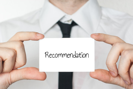 businessman holding card with text recommendation - image for scholarship letter of recommendation