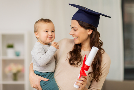 education, graduation and motherhood concept - happy mother student with baby boy and diploma at home - pell grant for single mothers