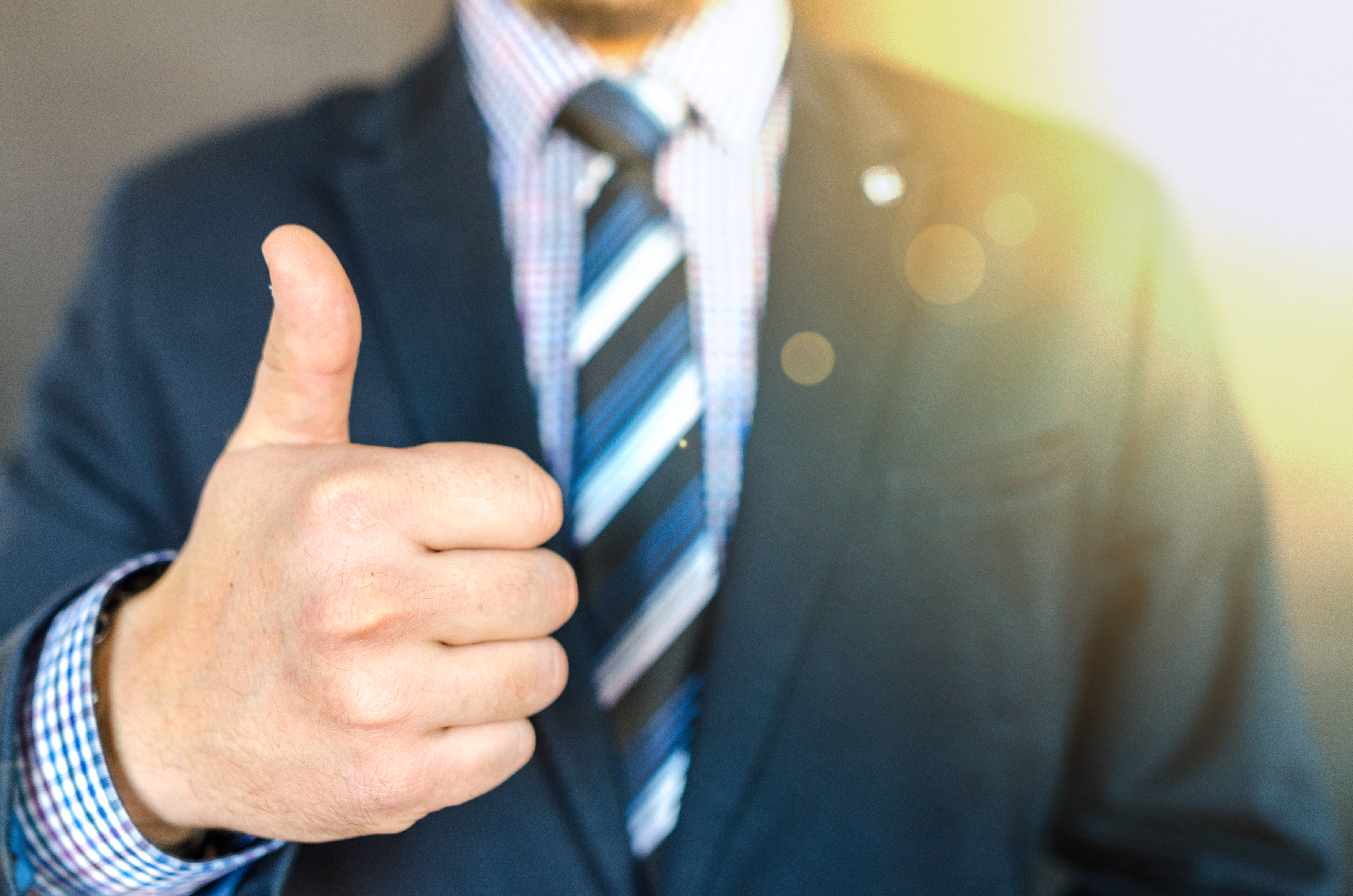 scholarship letter recommendation man in suit thumbs up